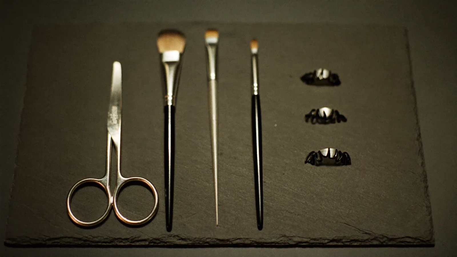 Lash and brow tinting tools laid out on a tray